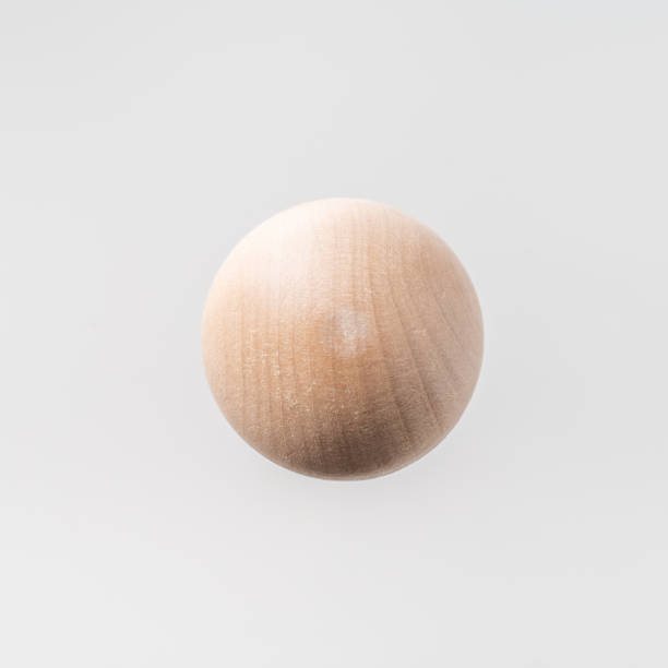 istock Abstract floating wooden half ball on white background 1097206410