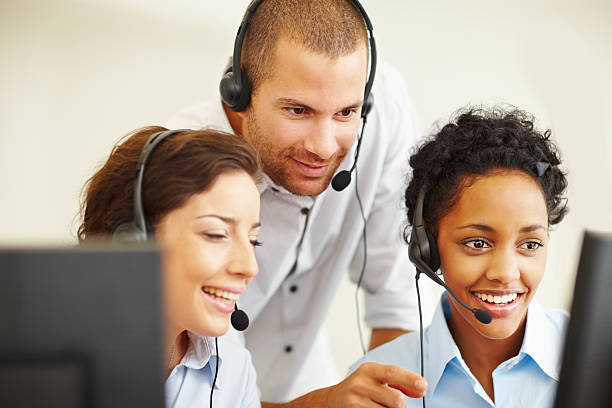 istock Happy call center employees working in office 109720693