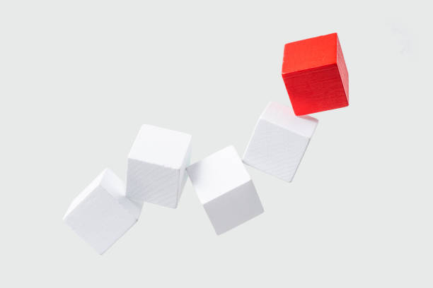 Business & design concept - Abstract geometric real floating wooden dice isolated on background, it's not 3D render. symbol of leadership, teamwork and success