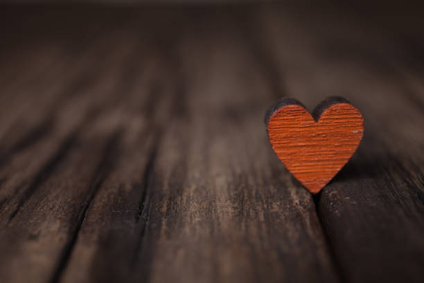 Valentines day red heart on old wooden background. Holidays card with copy space. stock photo