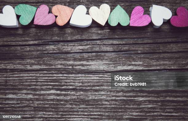 Valentines Day Card A Colorful Hearts On A Old Wooden Background Copy Space For Text Stock Photo - Download Image Now