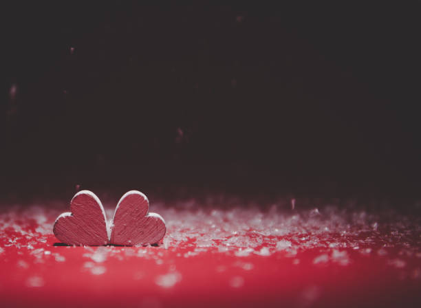Two Hearts on red background. Valentines day card. Copy space for your text. stock photo