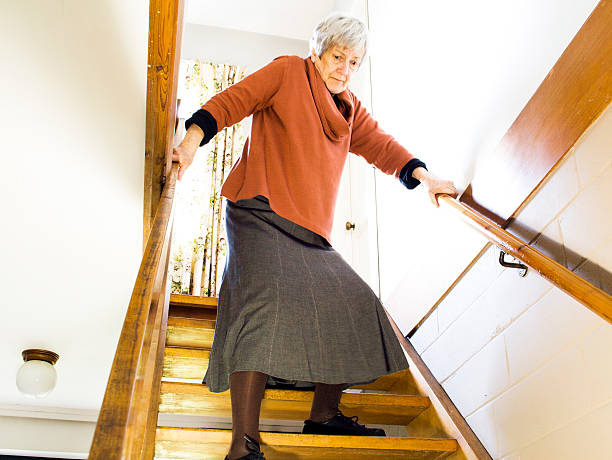 The Elderly and Stairs: Descending  caution step stock pictures, royalty-free photos & images