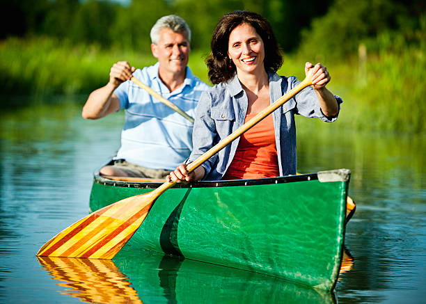 Family in a canoe on the Biebrza river national park, Poland.