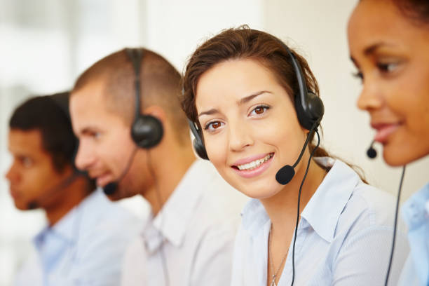 istock Smiling call center employee with her colleagues 109721315