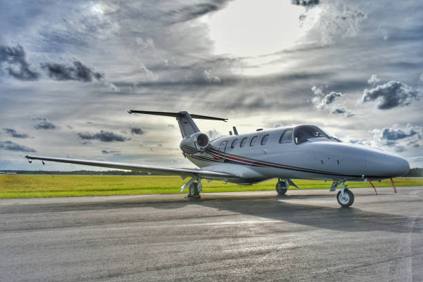 istock Business Jet on Ramp with Sun in Background 1097216042