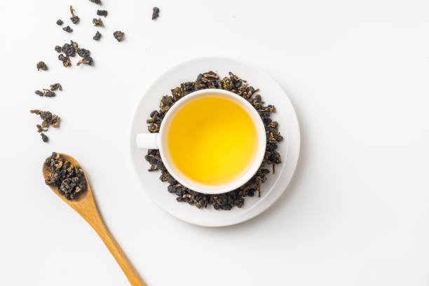 fresh taiwan oolong tea and cup Asia culture and design concept - fresh taiwan oolong tea and cup oolong tea stock pictures, royalty-free photos & images
