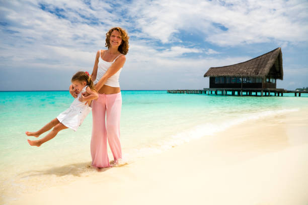 istock Mother and Little Daughter Having Fun on Tropical Beach 109721622