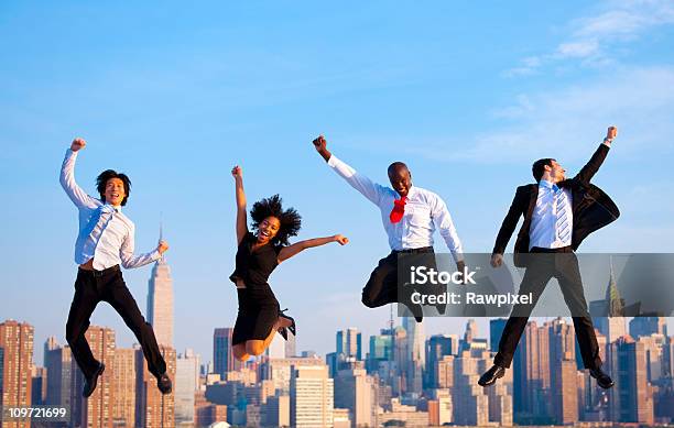 Happy Successful Business People Celebrating By Jumping In New York Stock Photo - Download Image Now