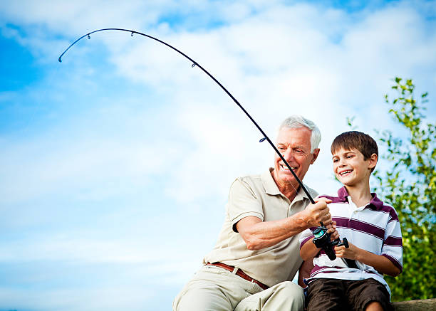 avô e neto de pesca - fishing active seniors family senior adult imagens e fotografias de stock