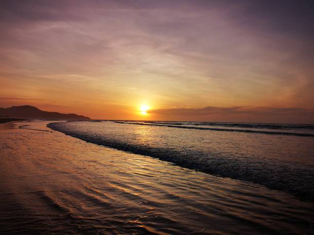 istock Beautiful sunset along the beach shore 1097218254