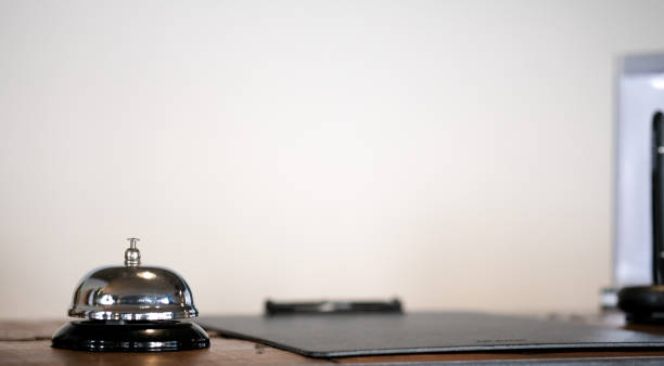istock Hotel reception counter desk with service bell. 1097219992