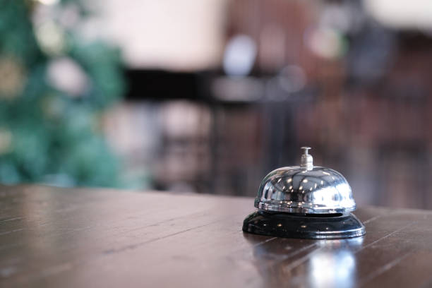 istock Hotel reception counter desk with service bell. 1097220018