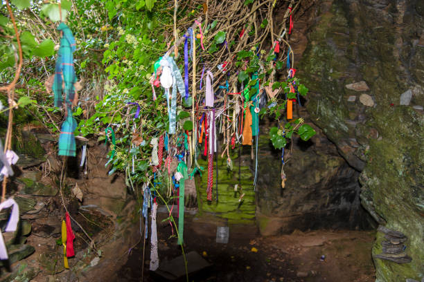 Clootie tree in Cornwall Clootie Tree at St Nectans Glenn near Tintagel in north Cornwall. Clootie Wells are places of pilgrimage in Celtic areas. Strips of cloth or rags are usually tied to a branch as part of a healing ritual. thomas wells stock pictures, royalty-free photos & images