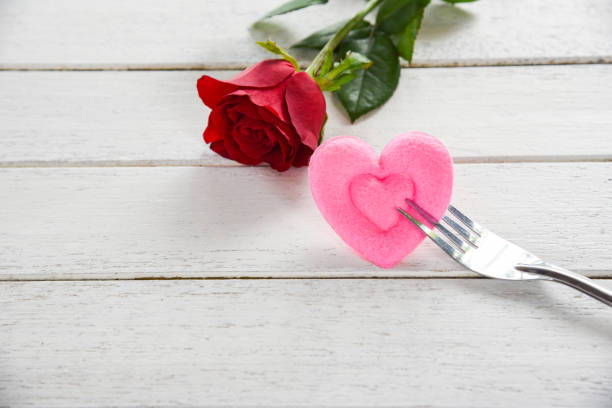 istock Valentines dinner romantic love food and love cooking concept - Romantic table setting decorated with red rose flower 1097220424