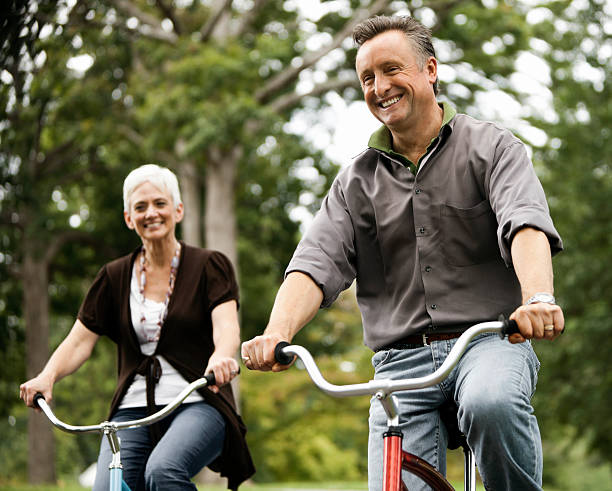 istock Senior Couple Biking Outdoors Together 109722046