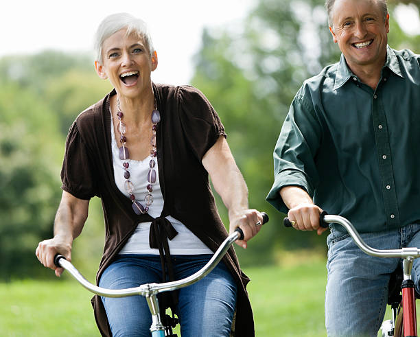 istock Senior Couple Biking Together in the Park 109722049