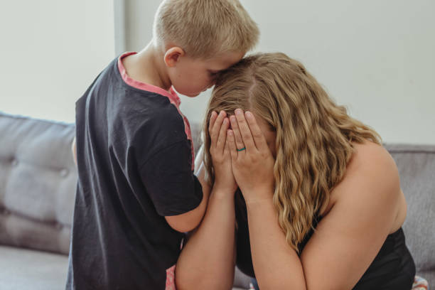istock Young boy comforting his mother 1097221808