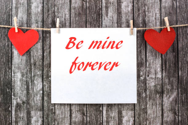 istock Valentine's hearts with empty piece of paper. 1097222120