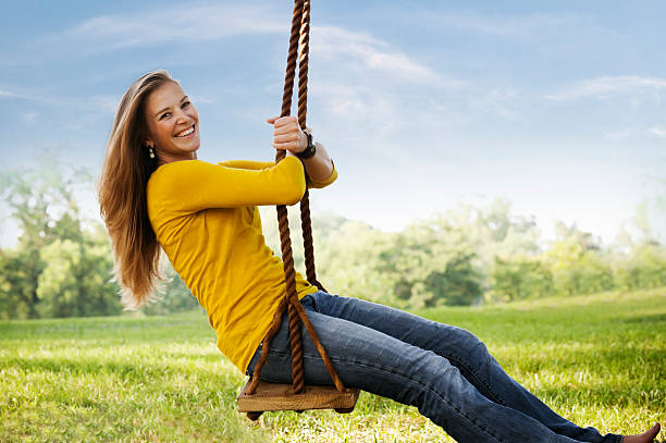 wooden swing is on garden horizontal close up still