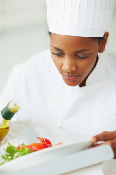 istock Female chef garnishing salad 109722294