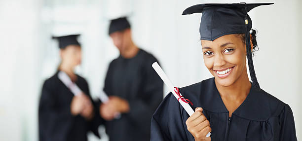 istock Female graduate smiling with friends at the back 109722295