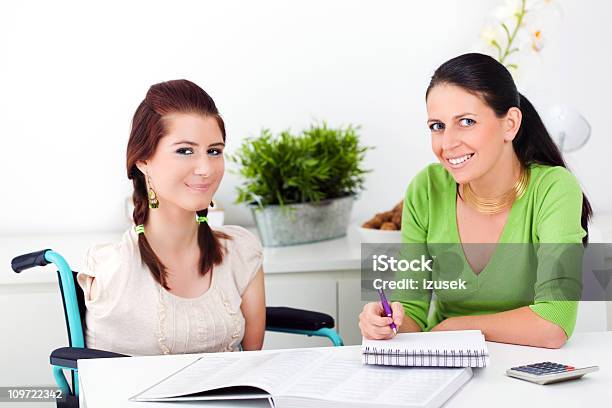 Disabled Girl With Her Health Advisor Stock Photo - Download Image Now - 16-17 Years, Adult, Advice