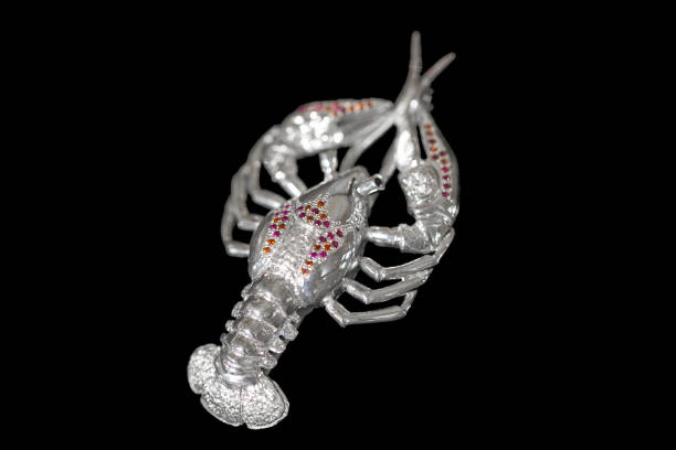 istock Silver crayfish. Jewelery with precious stones on a black background 1097223544