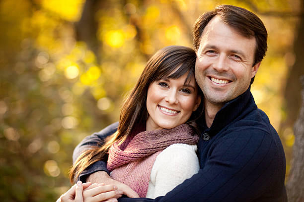 istock Happy Couple Sitting Together Outside During Autumn 109722543