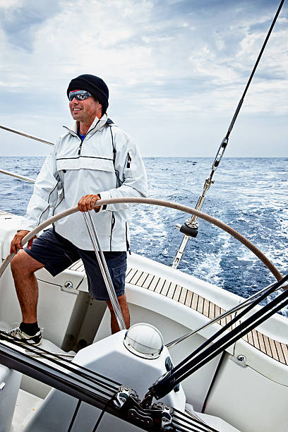istock Happy skipper driving sailing ship in bad weather 109722593