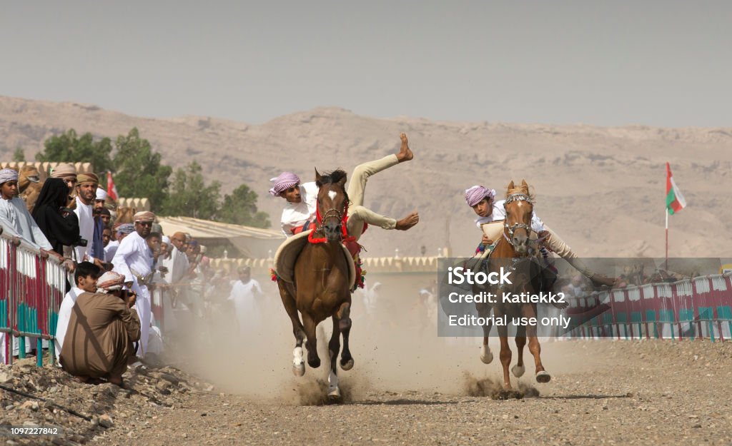 Man Trick Riding Omani Men Trick Riding Their Hoses Side By Side Stock Photo - Download ...