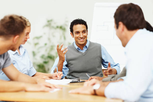 istock Happy business group sitting together for discussion 109722974