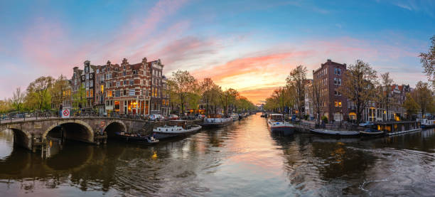 istock Amsterdam Netherlands, sunset panorama city skyline at canal waterfront 1097229814