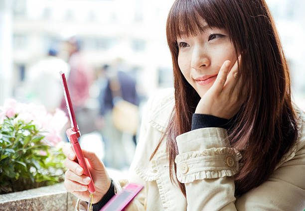 Young Asian Woman with Mobile Phone stock photo