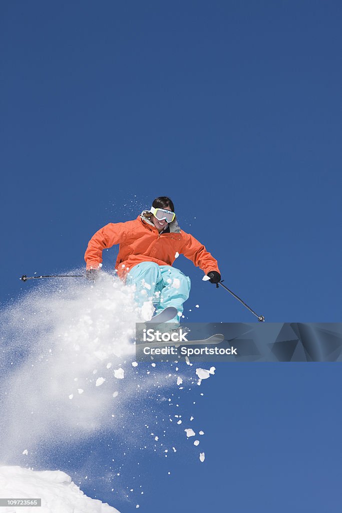 Extreme Ski Jump Young man caught in mid-air making ski jump in Keystone, Colorado. Activity Stock Photo