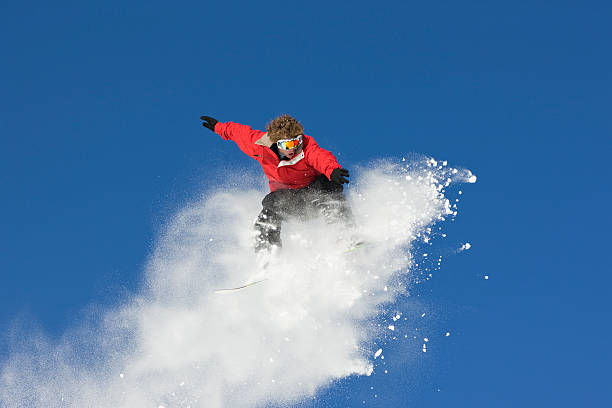 istock Extreme Snowboard Jump Against Blue Sky 109723579