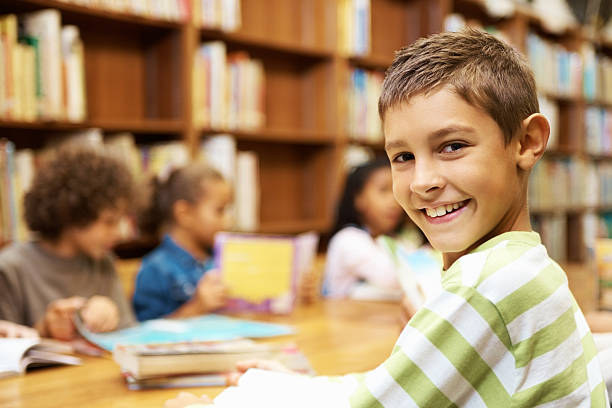 istock Closeup of happy student sitting in a school library 109723675