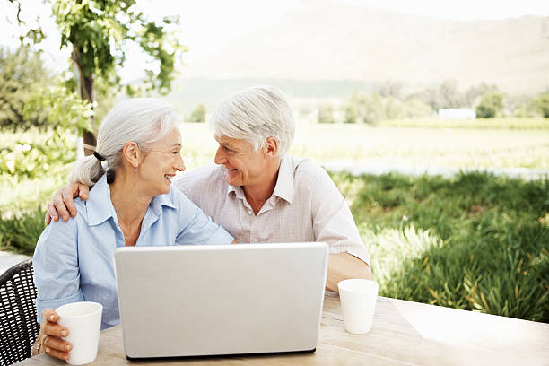 istock Happy Senior Couple Outdoors With Laptop 109724266