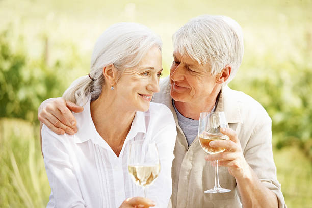 istock Affectionate Senior Couple Sharing Wine Outdoors 109724274
