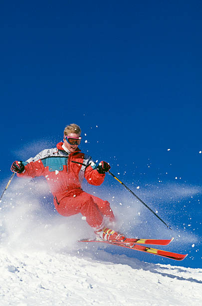 istock Snow Skier Flying Over Mogul Against Blue Sky 109724327