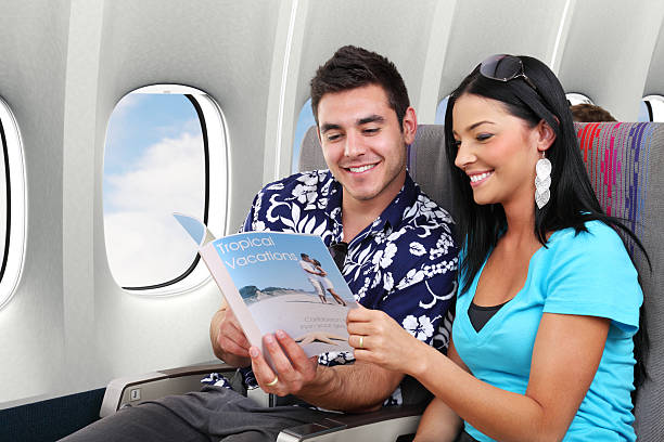 istock Couple Reading Travel Magazine 109724354