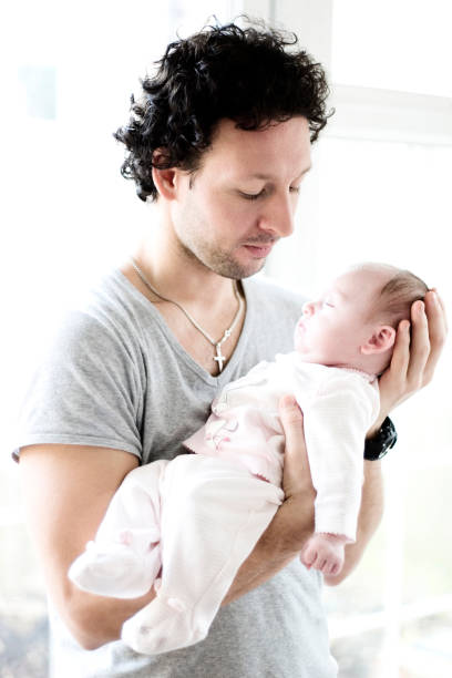 istock Father Holding Newborn Baby Daughter 109724392