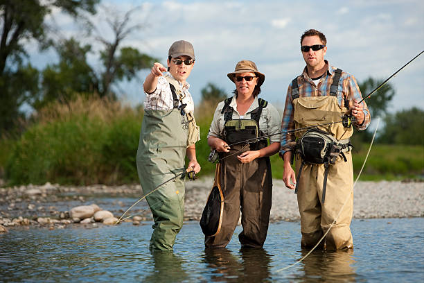 Fly Fishing Guide Teaching Couple stock photo
