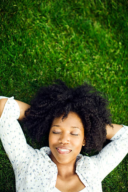 istock Dreaming Young Woman on Grass 109724683