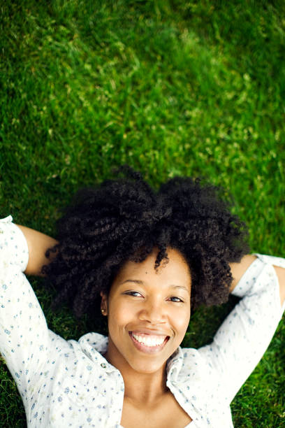 istock Happy Young Woman on Grass 109724882