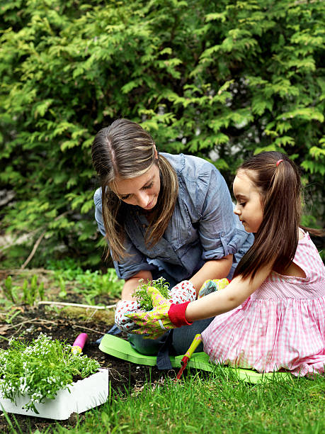 istock Mother and daughter gardening 109724906