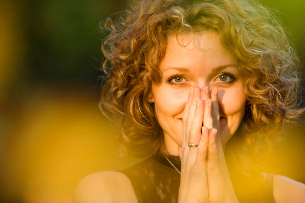 Young Woman Laughing and Looking at Camera stock photo