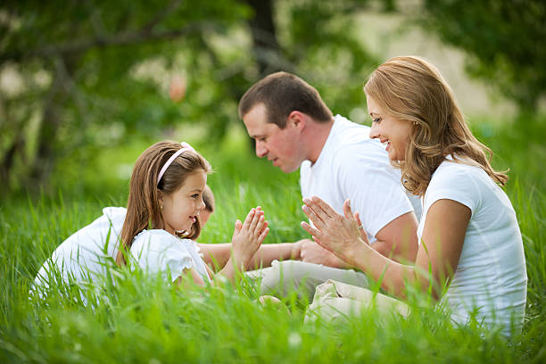 istock Family playing games in grass 109725077