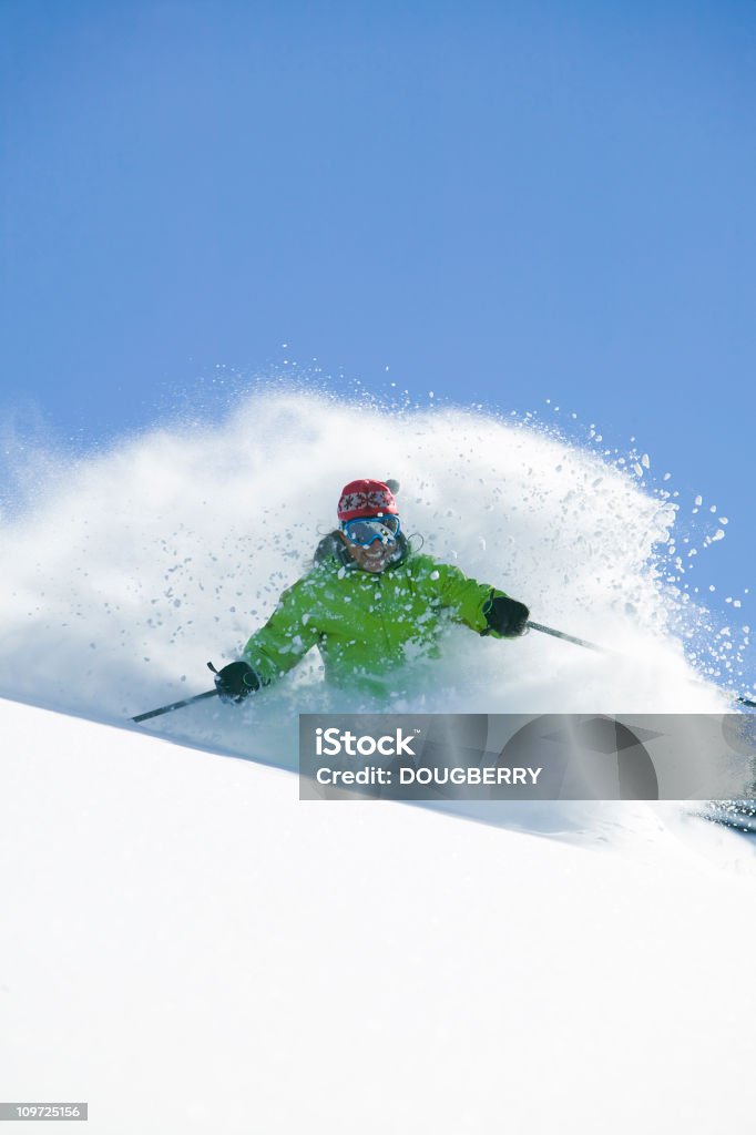 Female skiing in fresh powder snow  One Woman Only Stock Photo