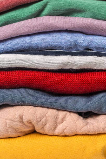 istock Stacks of folded clothes, close up 1097252298